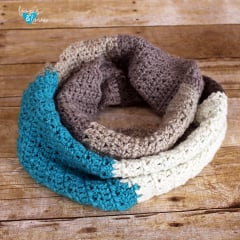 crochet infinity scarf with textured stitches and blocks of color