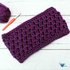 crochet cowl in dark purple stitches