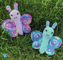 Crochet butterflies in the grass