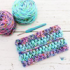 crochet cowl in turquoise puff stitches and pink ridges