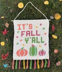 crochet wall hanging with It's Fall Y'all written on it