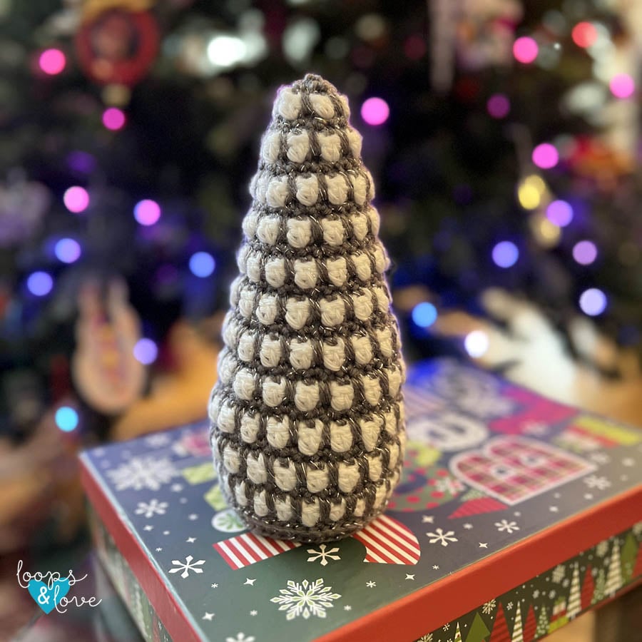 White and silver crochet Christmas tree with textured stitch details