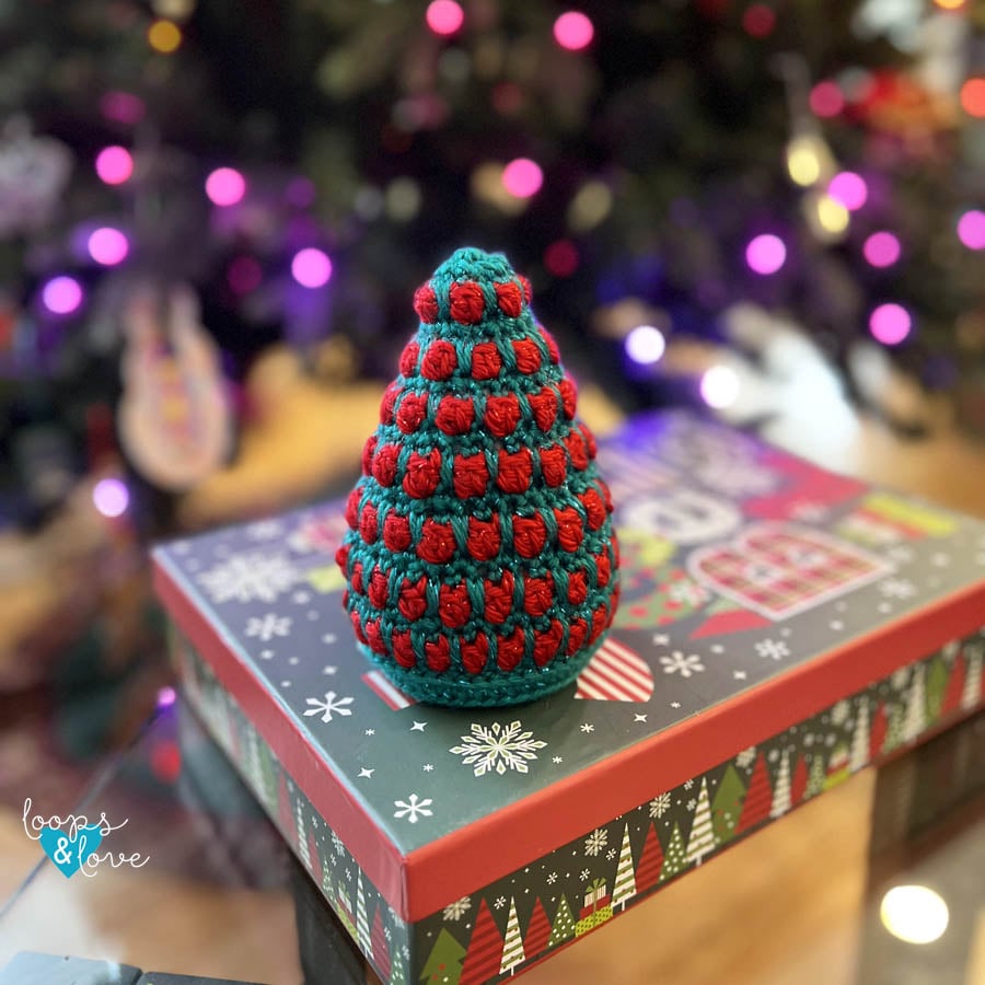 Small textured crochet Christmas tree measuring approximately 5.5 inches tall