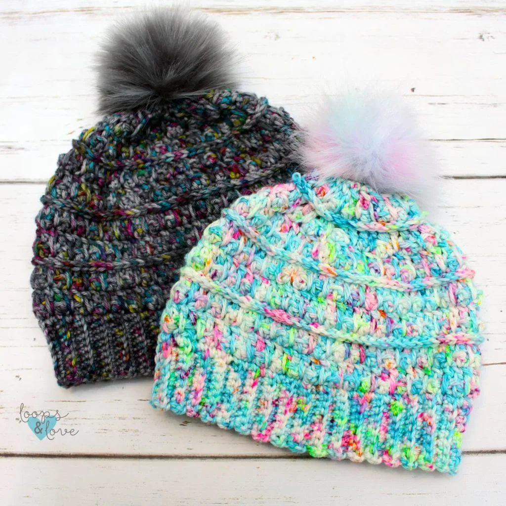 Crocheted beanies with pompoms