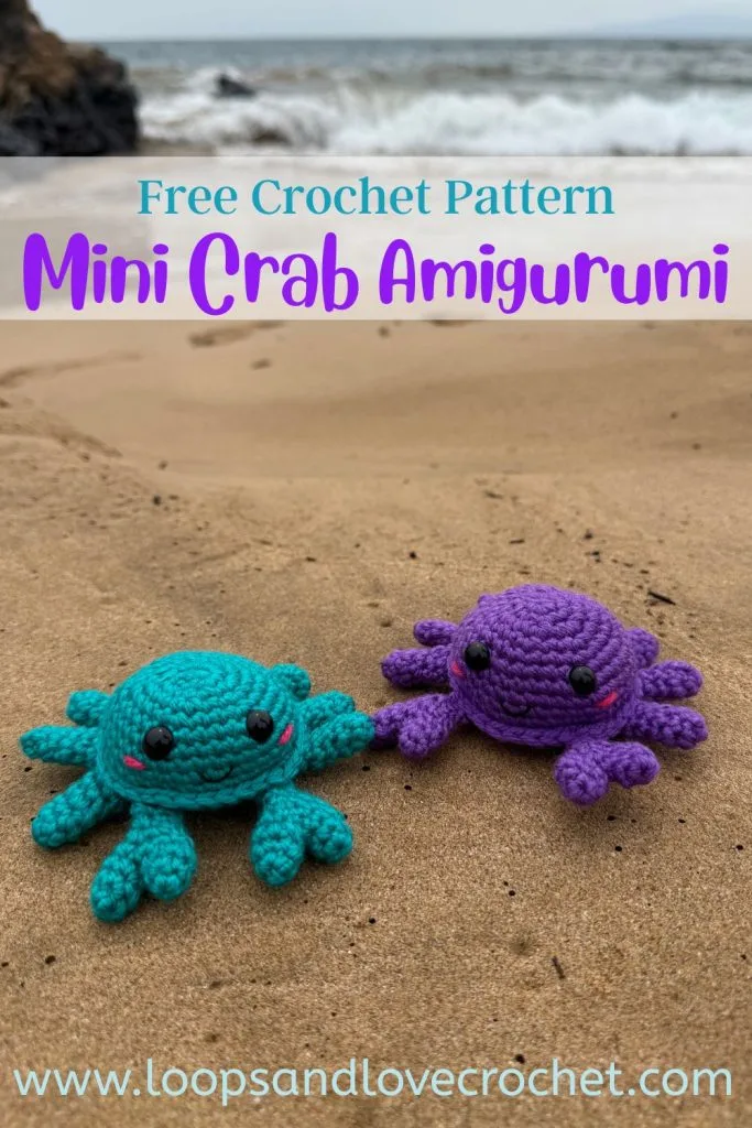 mini crab amigurumi on sand