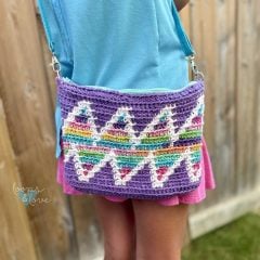 kid wearing crochet bag with a rainbow wave design