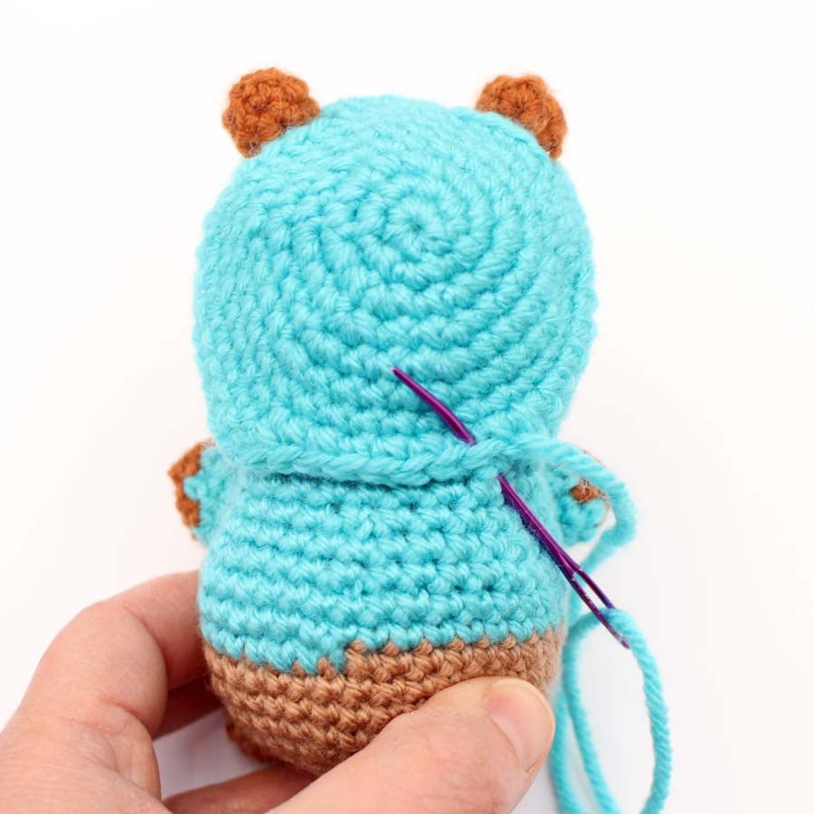 sewing on the capybara hood